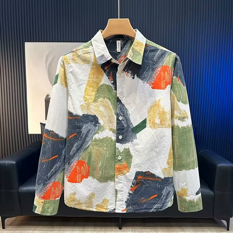 Forest Canvas shirt, front view on a wooden hanger: ivory cotton painted with moss green, olive, ochre, burnt orange and charcoal brushstrokes.